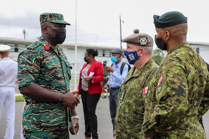 A Guyanese Defense Force officer interacts with a member of the Canadian Army following the opening ceremony of Tradewinds 2021. Tradewinds 2021 is a U.S. Southern Command sponsored Caribbean security-focused exercise in the ground, air, sea, and cyber domains, working with partner nations to conduct joint, combined and interagency training, focused on increasing regional cooperation and stability. (U.S. Army photo by Spc. N.W. Huertas)