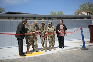 Senior Airman Ricardo Morales, center right, 461st Aircraft Maintenance Group crew chief, along with leadership from Robins Air Force Base and Fifteenth Air Force cut the ribbon for the newly installed Intelligent Lockers at Robins Air Force Base, Ga., March 30, 2022. Morales secured $235,000 for Robins AFB to pay for the lockers by winning first place for his idea in the 2021 Air Force Installation and Mission Support Center Innovation Rodeo, a contest that encourages Airmen to develop creative solutions to problems impacting the Air Force. (U.S. Air Force photo by Kisha Foster Johnson)