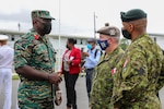 A Guyanese Defense Force officer interacts with a member of the Canadian Army following the opening ceremony of Tradewinds 2021. Tradewinds 2021 is a U.S. Southern Command sponsored Caribbean security-focused exercise in the ground, air, sea, and cyber domains, working with partner nations to conduct joint, combined and interagency training, focused on increasing regional cooperation and stability. (U.S. Army photo by Spc. N.W. Huertas)