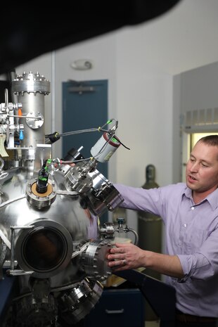 Nicholas Glavin, a senior materials scientist, with the Air Force Research Lab’s Materials and Manufacturing Directorate at Wright-Patterson Air Force Base, Ohio, uses AFRL’s custom magnetron sputtering system to fabricate and design new nanomaterials for Air Force applications Nov. 2, 2021. The system is capable of synthesizing materials down to the thickness of only a few atoms, where at that length scale, new and exciting properties emerge for future electronics and sensors. Glavin received the John L. McLucas Basic Research Award – Honorable Mention, as part of the 2021 Science, Technology, Engineering and Mathematics (STEM) awards announcement. He has been working with a team exploring the fundamental science behind two-dimensional materials.