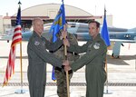 Maj. Gen. Bret C. Larson, 22nd Air Force commander, presents the 340th Flying Training Group command guidon to Col. Kyle Goldstein, 340th FTG commander, during the group’s change of command ceremony at Joint Base San Antonio-Randolph, Texas on March 31, 2022.