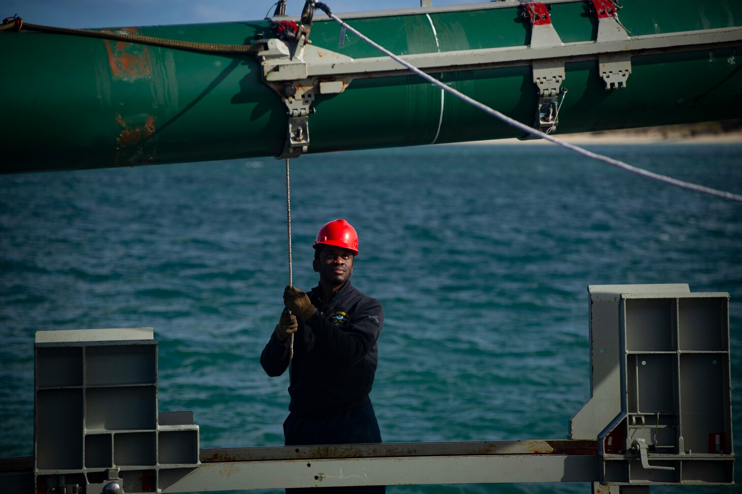 PERTH, Australia (April 28, 2022) – Sonar Technician (Submarine) 3rd Class Nathan Wright, from Orlando, Florida, assigned to the Los Angeles-class fast-attack submarine USS Springfield (SSN 761), lowers a Harpoon inert training shape into position during an expeditionary rearming exercise pierside at Royal Australian Navy base HMAS Stirling on Garden Island off the coast of Perth, Australia, April 28, 2022. Springfield is currently on patrol in support of national security in the U.S. 7th Fleet area of operations. (U.S. Navy photo by Mass Communication Specialist Seaman Wendy Arauz)