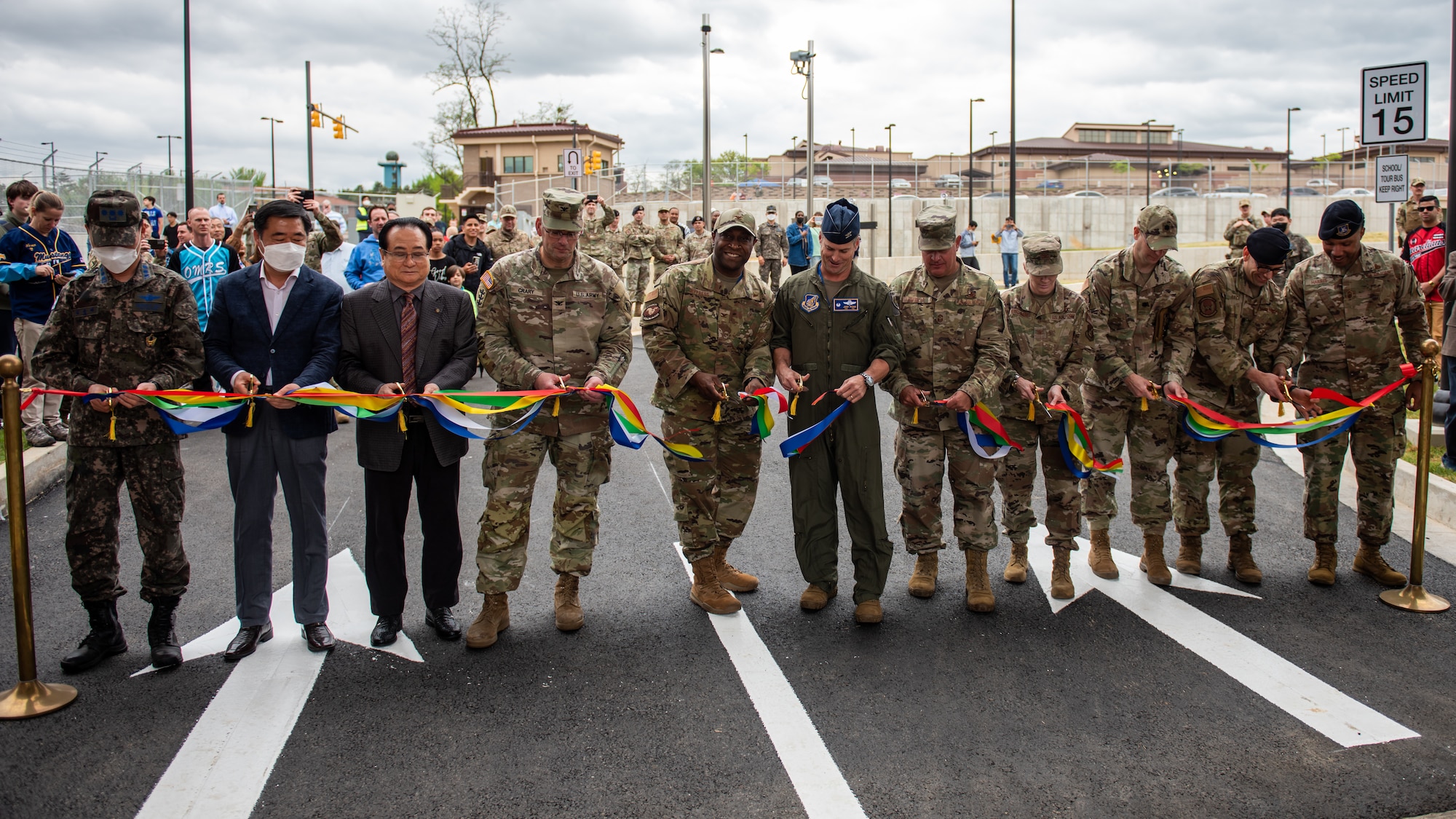 Team Osan leaders and community partners cut the ribbon at the main gate opening ceremony April 29, 2022 at Osan Air Base, Republic of Korea.