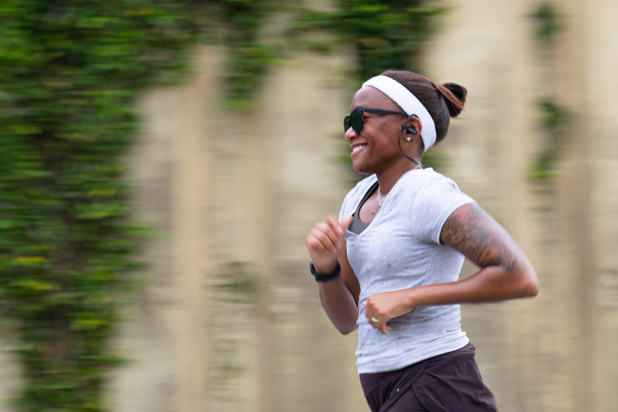 A runner participates in the 9th Annual Memorial for the Bataan Death March at Kadena Air Base, Japan, April 23, 2022. The 8.5-mile route around the flightline was tackled by 91 total participants, 18 runners, 45 walkers and 28 ruckers, with the fastest finishing time standing at 58 minutes and 12 seconds. (U.S. Air Force photo by Senior Airman Jessi Monte)