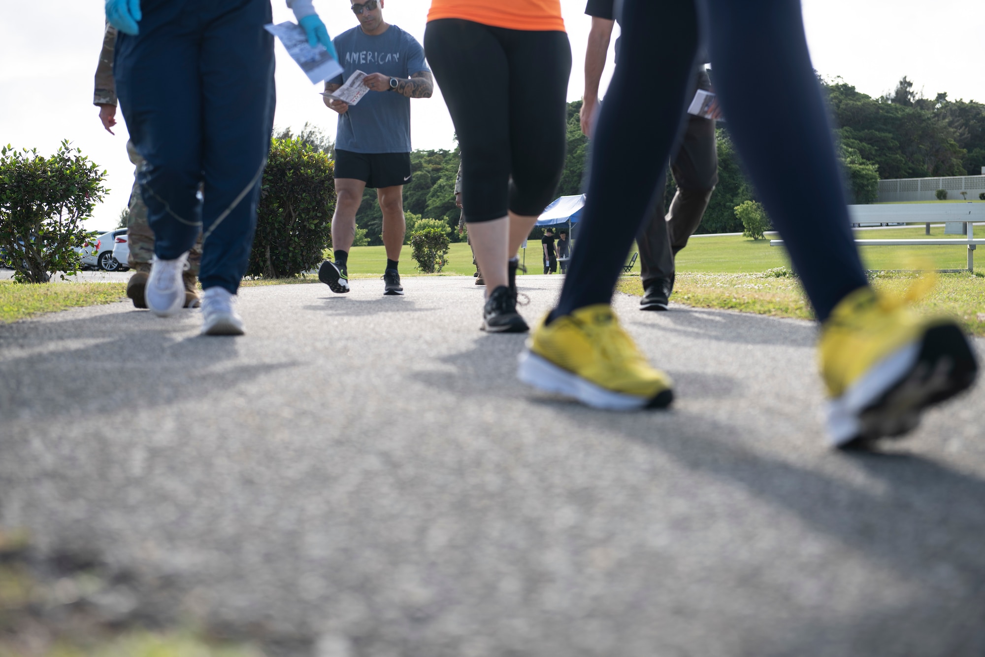 U.S. Air Force service members participate in a silent walk during Days of Remembrance week at Kadena Air Base, Japan, April 25, 2022. The walk was held as a symbolic way to honor those who suffered and perished during the Holocaust. (U.S. Air Force photo by Senior Airman Jessi Monte)