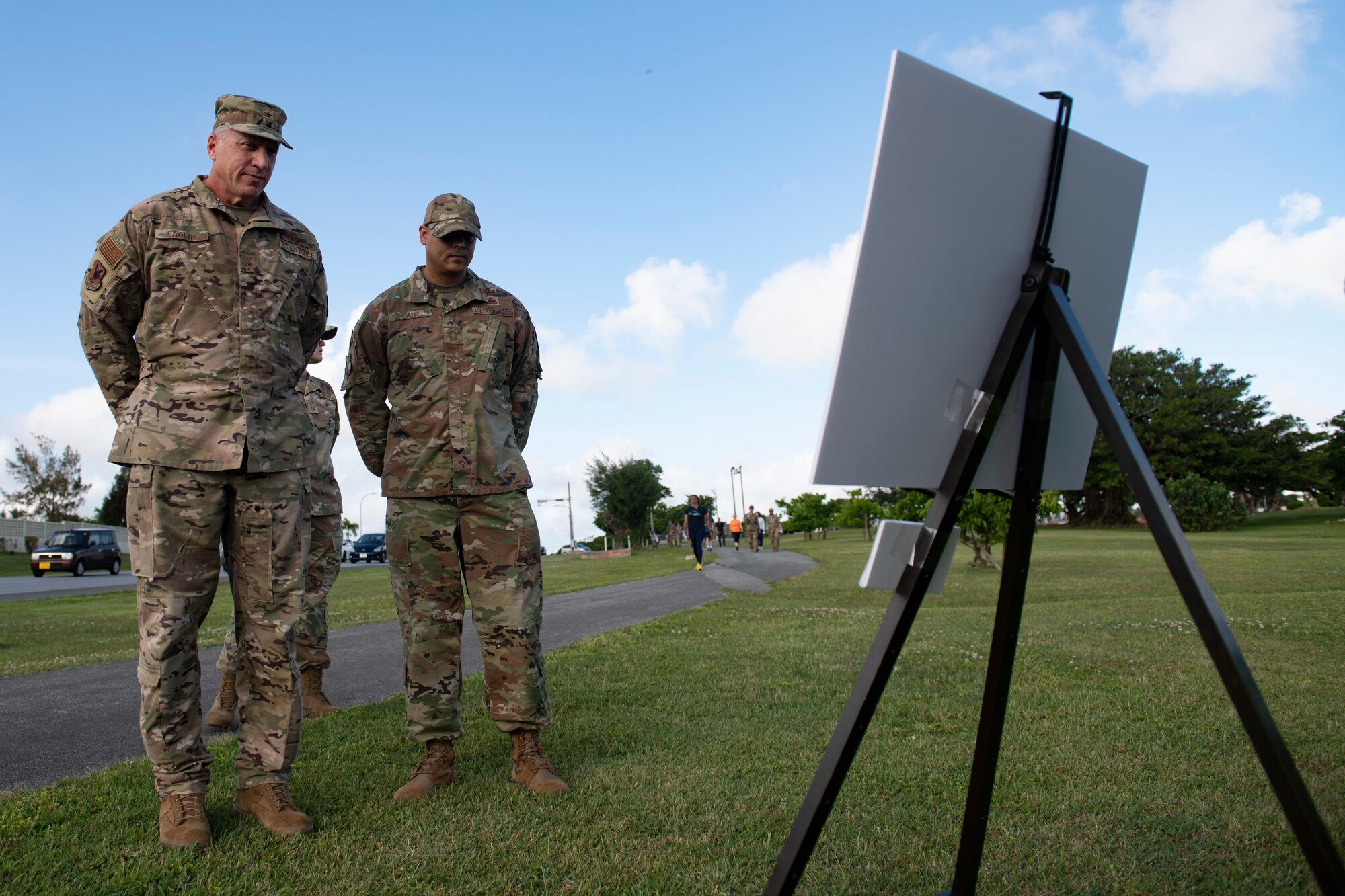 U.S. Air Force Brig. Gen. David Eaglin, 18th Wing commander, left, and Chief Master Sgt. Daniel Cain, Erwin Professional Military Education Center commandant, participate in a silent walk during Days of Remembrance week at Kadena Air Base, Japan, April 25, 2022. The U.S. Congress established the Days of Remembrance as the nation’s annual commemoration of the Holocaust. (U.S. Air Force photo by Senior Airman Jessi Monte)
