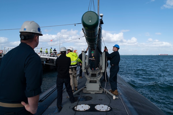 PERTH, Australia (April 28, 2022) – Sailors assigned to the Los Angeles-class fast-attack submarine USS Springfield (SSN 761) guide a Harpoon inert training shape into position while the submarine is pierside at Royal Australian Navy base HMAS Stirling on Garden Island, off the coast of Perth, Australia, April 28, 2022. Springfield is currently on patrol in support of national security in the U.S. 7th Fleet area of operations. (U.S. Navy photo by Mass Communication Specialist 1st Class Charlotte C. Oliver)