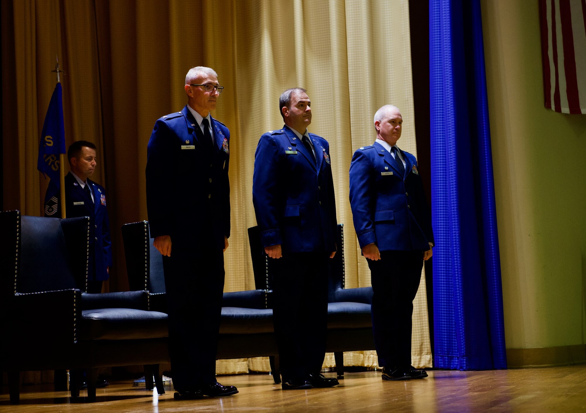 Col. James Mach, 927th Operations Group commander, Lt. Col. Marc McAllister, and Lt. Col. Andrew Doerr, 63rd Air Refueling Squadron commander, stand at attention during a change of command ceremony on MacDill Air Force Base, Fla., April 30, 2022.