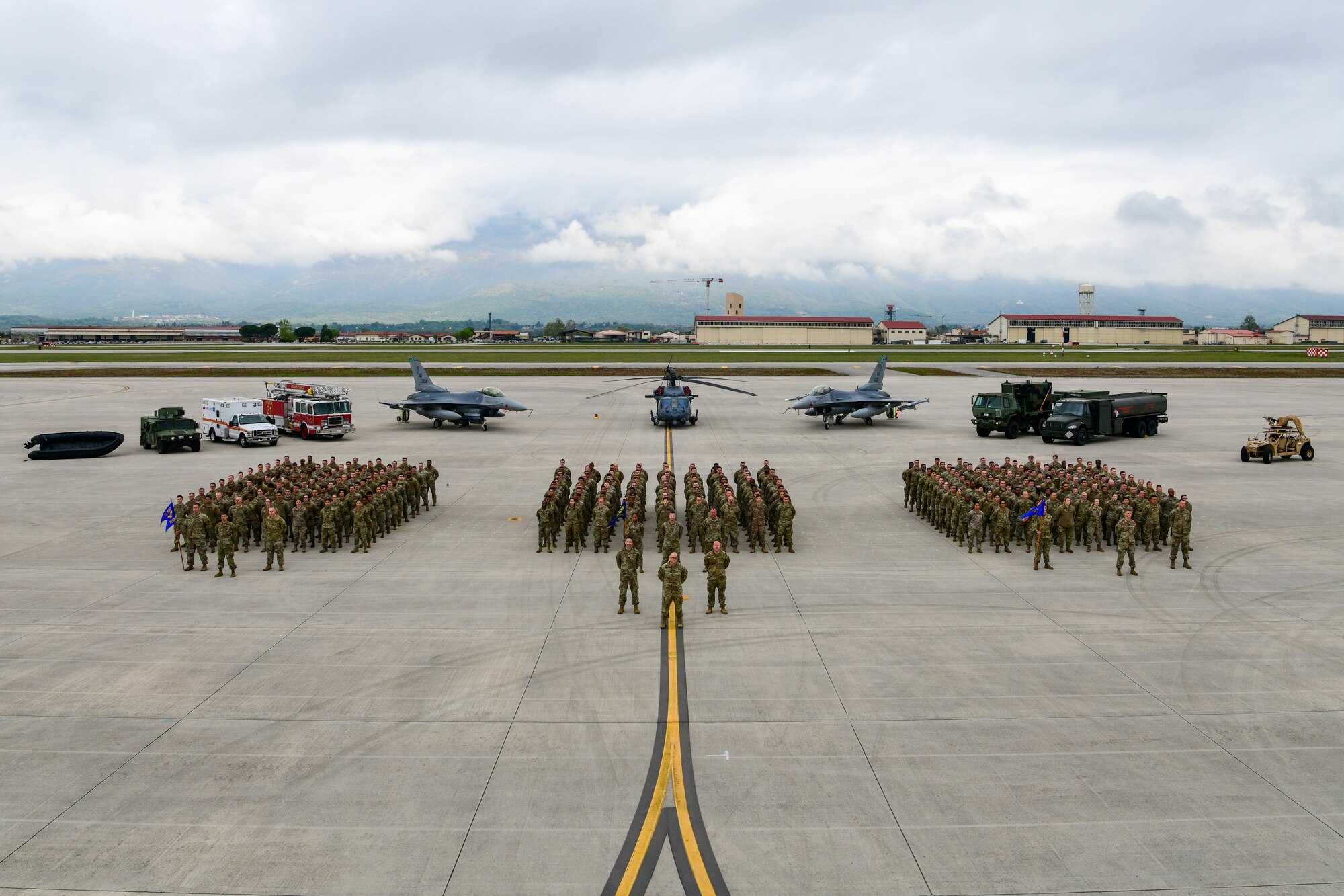 U.S. Air Force Airmen assigned to the 31st Maintenance Group pose for a photo at Aviano Air Base, Italy, April 25, 2022. The 31st MXG was awarded the 2021 Clements McMullen Memorial Daedalian Weapon System Maintenance Trophy at the Air Force level. This award is presented annually to a U.S. Air Force unit determined to have the best weapon system maintenance record for the previous calendar year. (U.S. Air Force photo by Senior Airman Brooke Moeder)