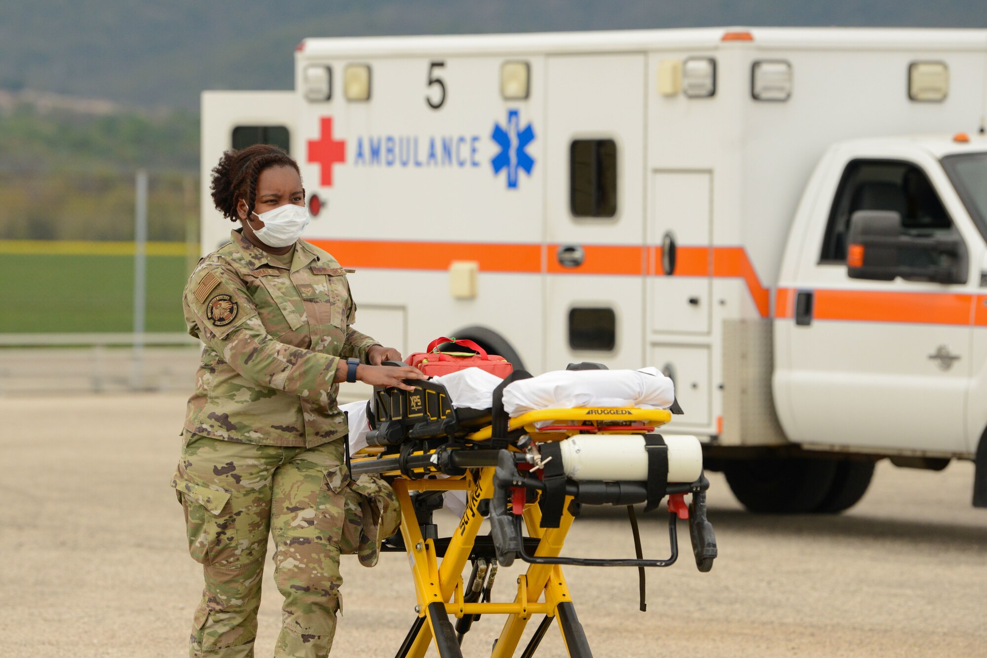 Airman 1st Class Marshay Thomas, 31st Health Care Operations Squadron aerospace medical technician, wheels a stretcher to a simulated incapacitated person during an exercise