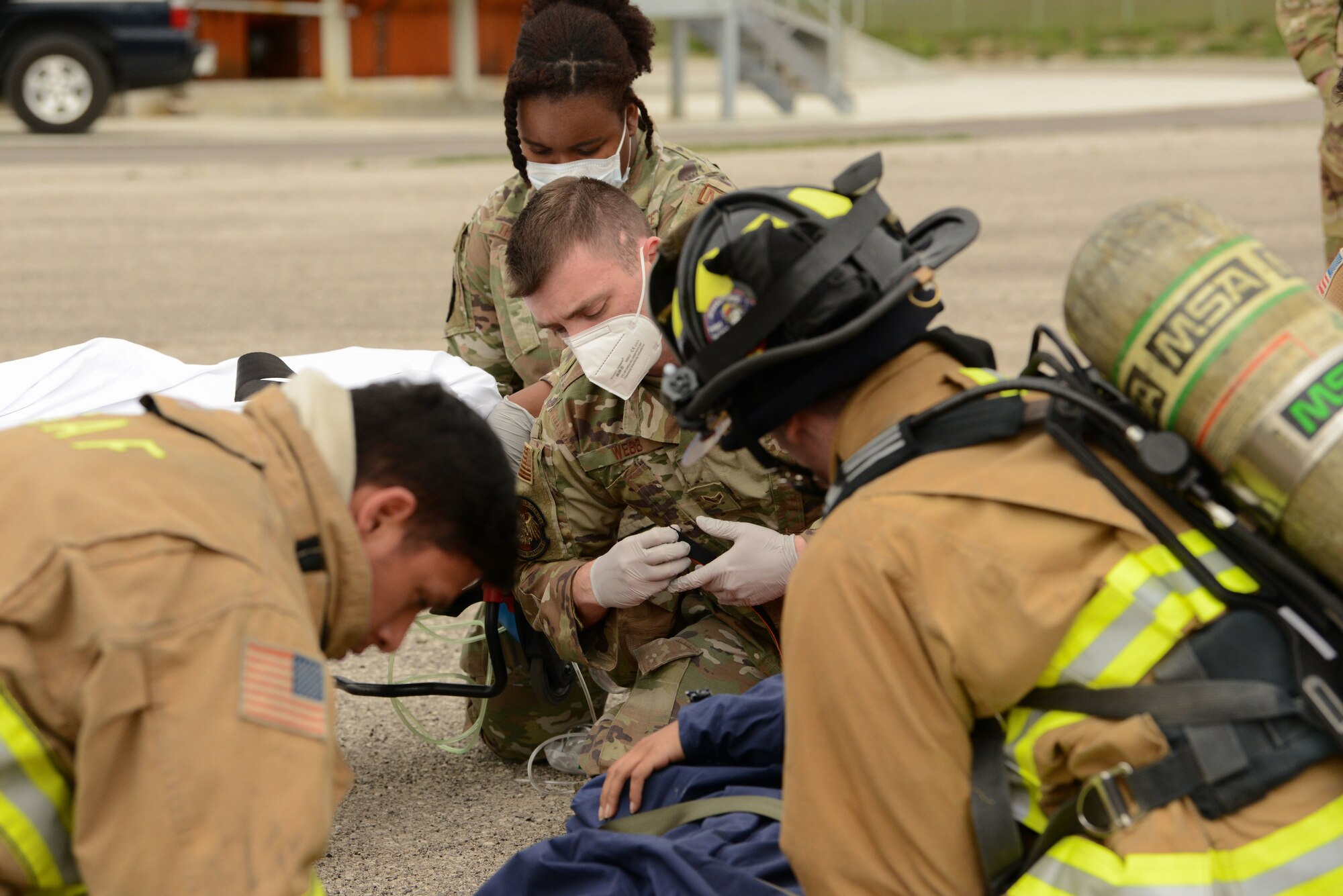 Airmen assigned to different 31st Fighter Wing response agencies work together during their annual fuel tank extraction exercise