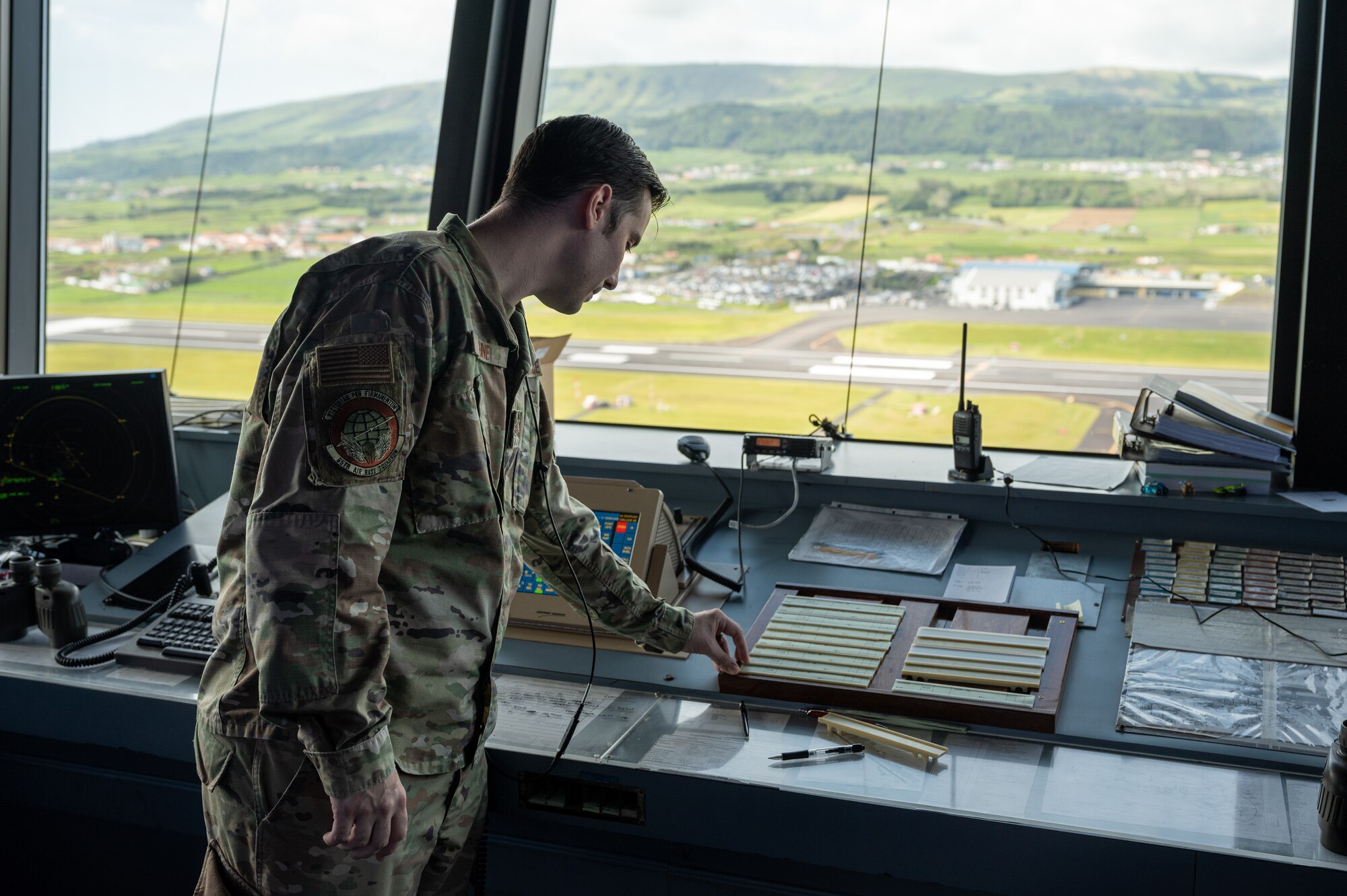 Airman working in an air traffic control tower.