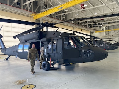 Connecticut National Guardsmen assigned to Charlie Company, 3rd Battalion, 142nd Aviation Regiment, inspect a new UH-60M Black Hawk helicopter at Joint Base McGuire-Dix-Lakehurst, New Jersey, April 28, 2022. The acquisition of this helicopter completes the unit’s conversion from old L-model aircraft to new M-model Black Hawks.
