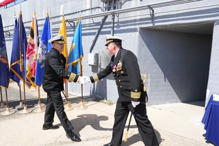 IMAGE: Incoming Naval Surface Warfare Center Dahlgren Division (NSWCDD) Commanding Officer Capt. Philip “Phil” Mlynarksi (left) shakes hands with outgoing NSWCDD Commanding Officer Capt. Stephen “Casey” Plew following the change of command ceremony, April 29.