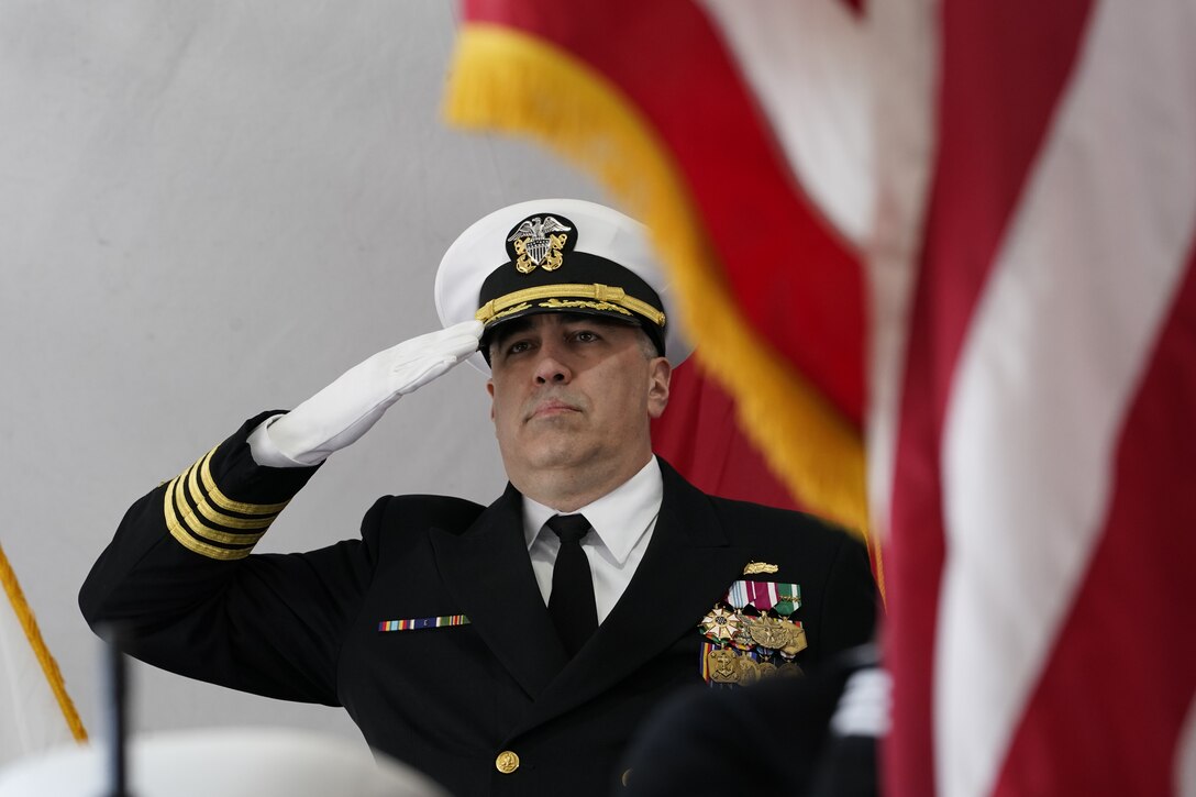 IMAGE: Capt. Philip Mlynarksi, incoming commanding officer of the Naval Surface Warfare Center Dahlgren Division (NSWCDD) salutes during the presentation of colors during the change of command ceremony, April 29. Mlynarski comes to NSWCDD after serving as the commanding officer of AEGIS technical representative in Moorestown, New Jersey.