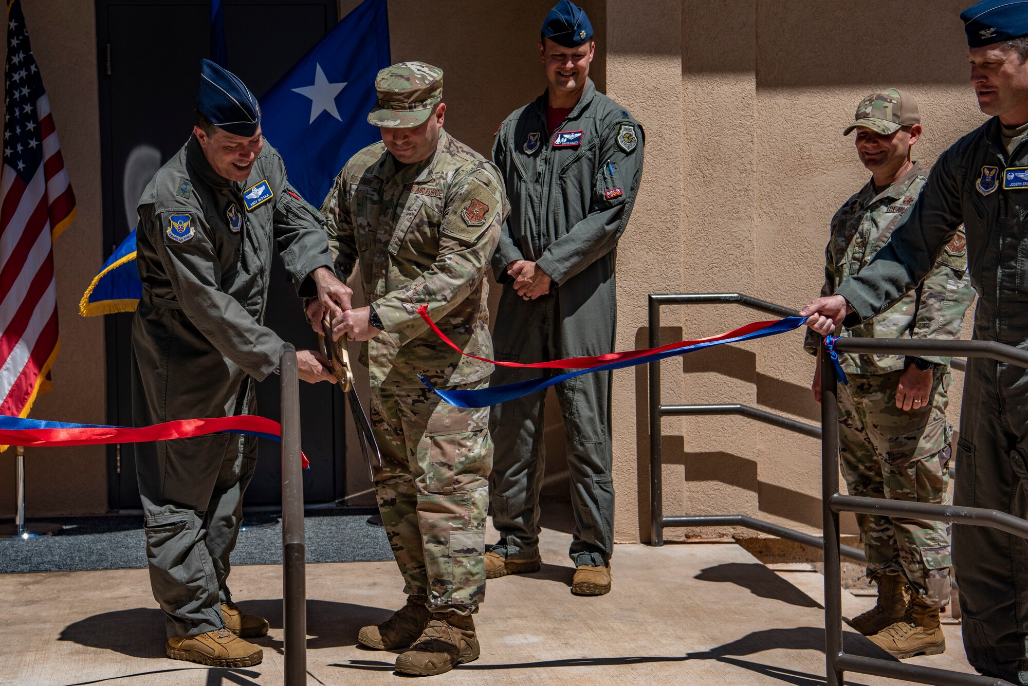 Maj. Gen. Andrew Gebara, 8th Air Force and Joint-Global Strike Operations Center commander, cuts the ribbon with Chief Master Sgt. Steve Cenov, 8th Air Force command chief and J-GSOC senior enlisted leader, during the mission planning building ribbon cutting at Dyess Air Force Base, Texas, April 29, 2022. The 8th Air Force command team leads one of the two active duty numbered air forces in Air Force Global Strike Command and provides strategic deterrence through airpower. (U.S. Air Force photo by Airman 1st Class Ryan Hayman)