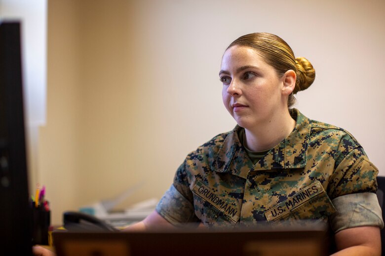 U.S. Marine Corps Cpl. Stephanie E. Grundmann, a legal chief with Headquarters and Headquarters Squadron, processes an administrative request on Marine Corps Air Station (MCAS) New River in Jacksonville, North Carolina, April 20, 2022. Grundmann, the recipient of the MCAS New River Go-Getter of the month award, enlisted into the Marine Corps in Aug. 2018 from Cresco, Pennsylvania. (U.S. Marine Corps photo by Lance Cpl. Alexis Sanchez)