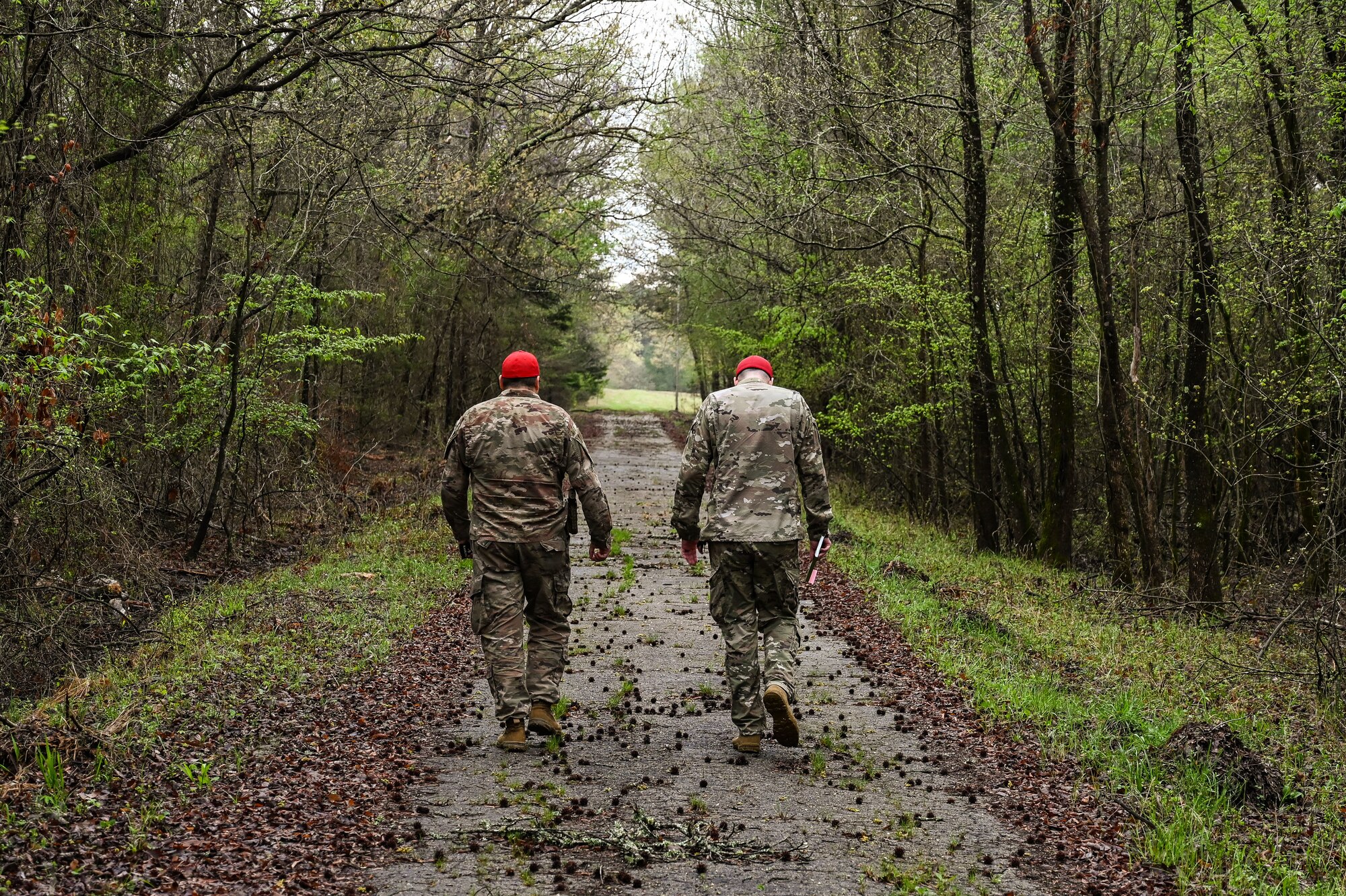 Instructors from the 19th Security Forces Squadron combat arms training and maintenance team walk toward the firing line during an Advanced Designated Marksman course