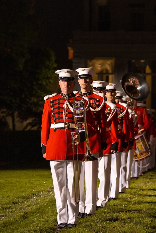 Marine Band musicians stand at attention during the 2022 full dress parade rehearsal at Marine Barracks Washington.