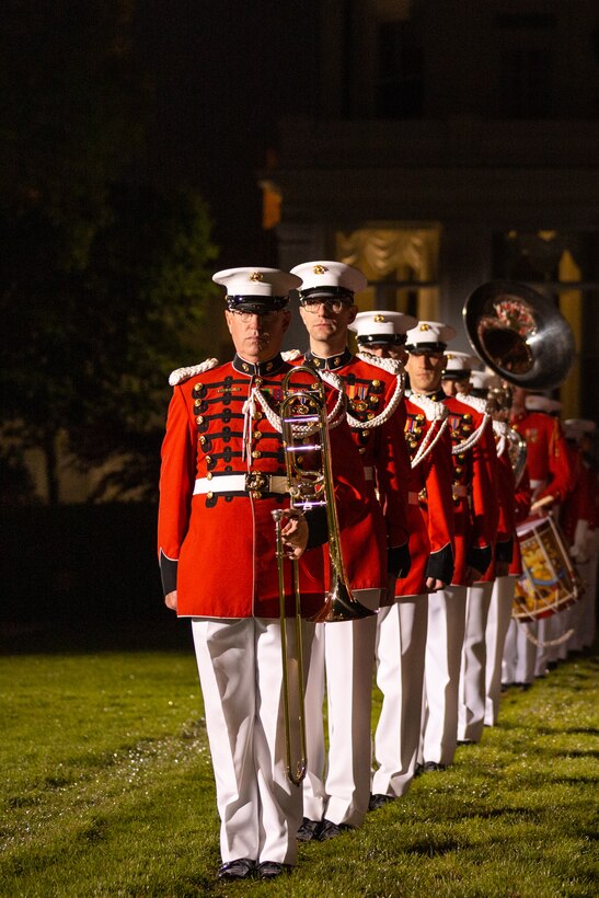 Marine Band musicians stand at attention during the 2022 full dress parade rehearsal at Marine Barracks Washington.