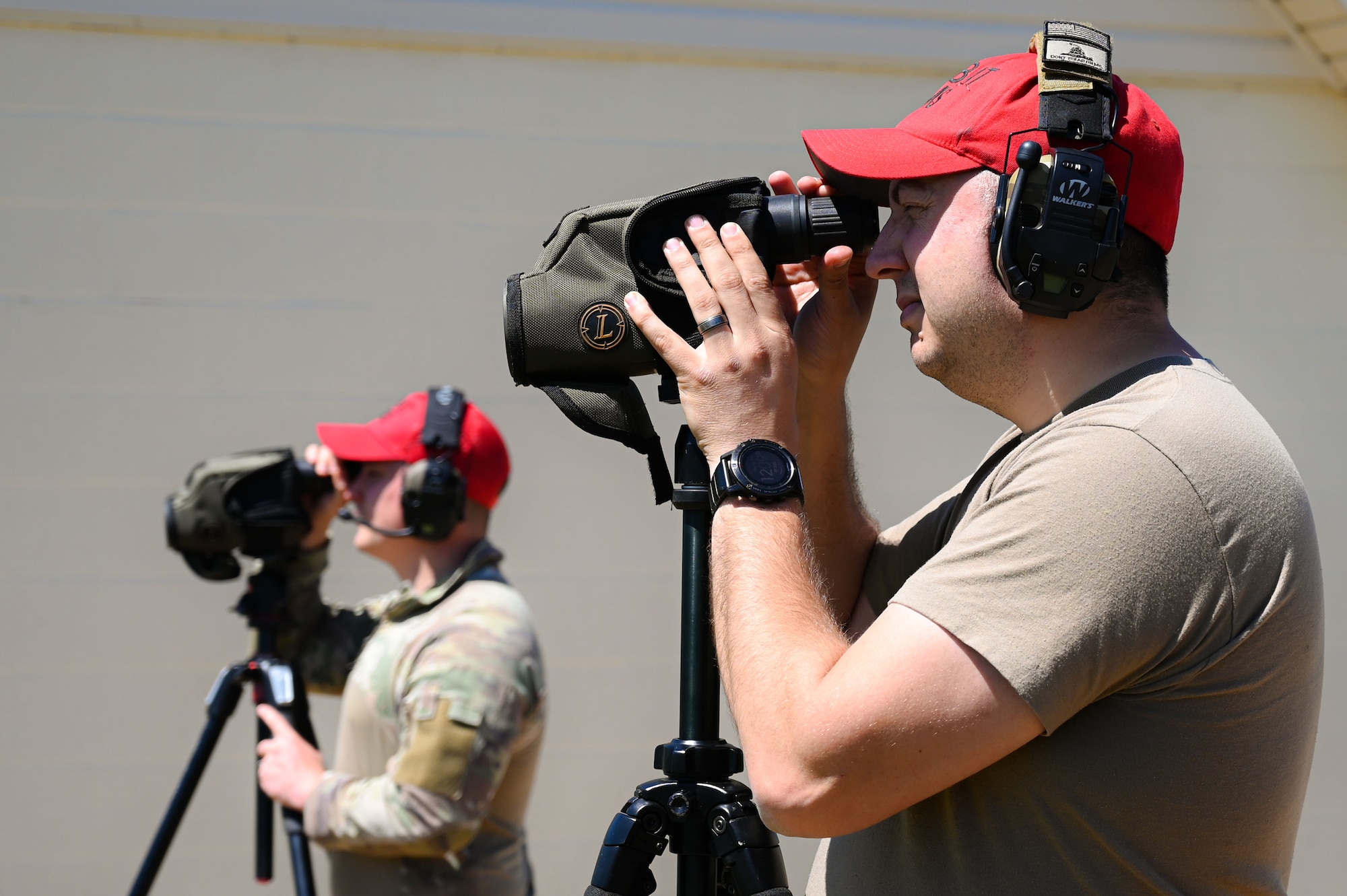 Airmen from the 19th Security Forces Squadron combat arms training and maintenance team check targets during an Advanced Designated Marksman course