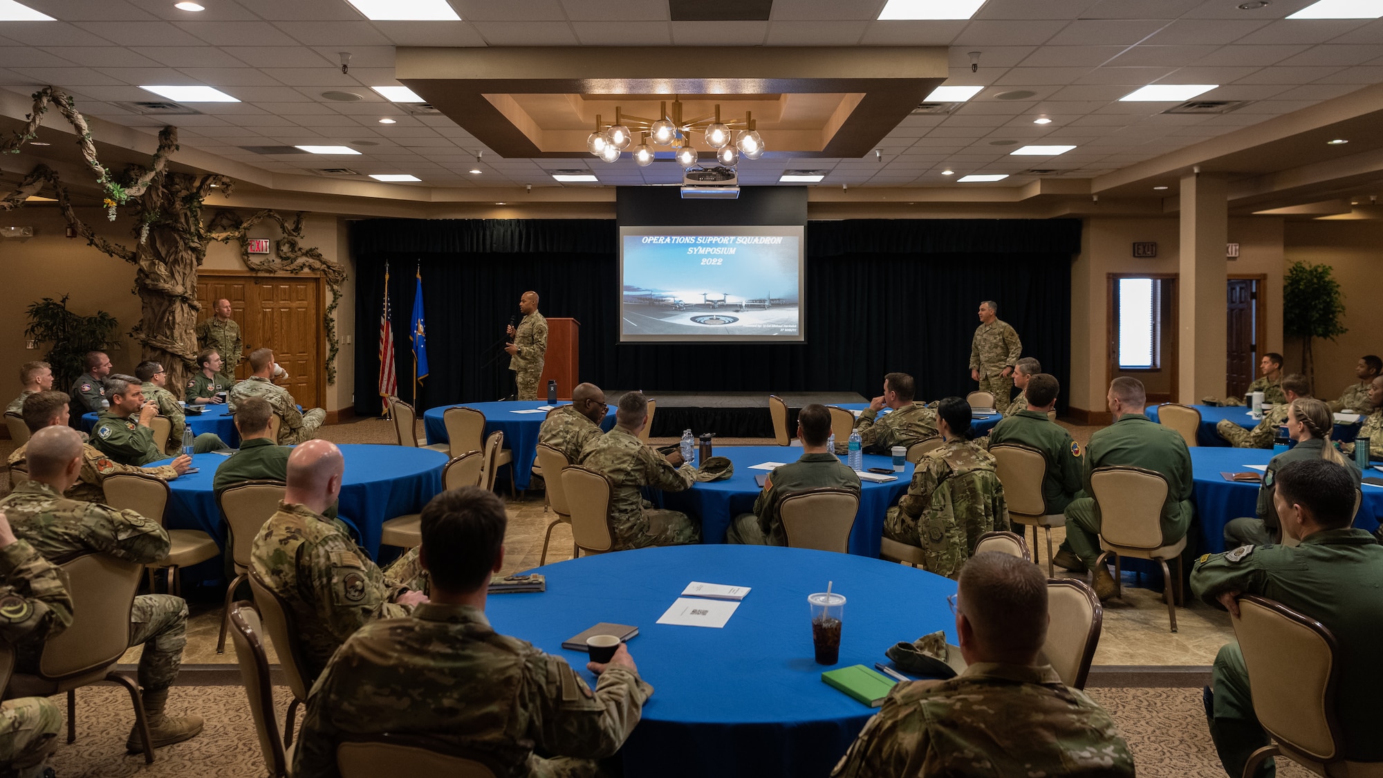Col. Taylor (left) and Chief Aiello speak to a crowd of Airmen and Guardians.