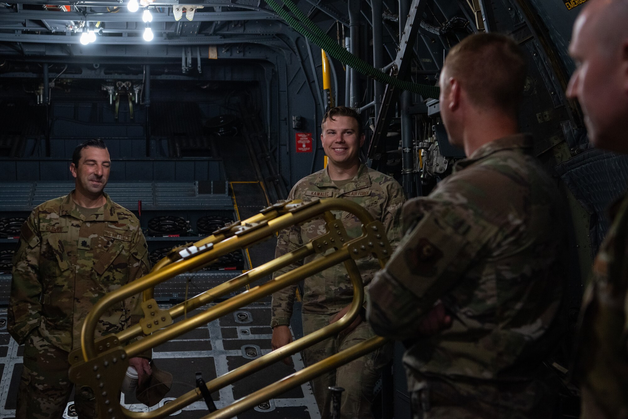 Airmen stand within a AC-130W Stinger II during a tour.