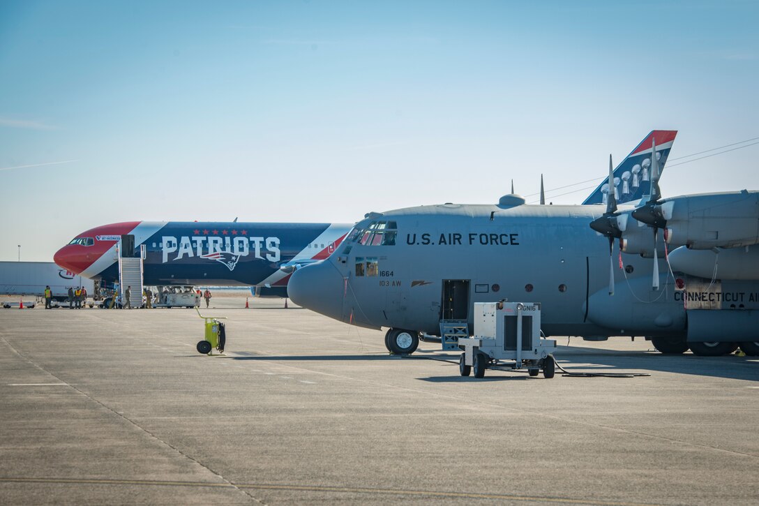 A Boeing 767-300ER is parked next to a 103rd Airlift Wing C-130H Hercules on the flight line at Bradley Air National Guard Base in East Granby, Connecticut, March 10, 2021. The “AirKraft” transported more than 100 deploying Soldiers from the Connecticut National Guard’s 1-102nd Infantry Regiment who will be supporting Operation Enduring Freedom’s Horn of Africa mission. (U.S. Air National Guard photo by Staff Sgt. Steven Tucker)