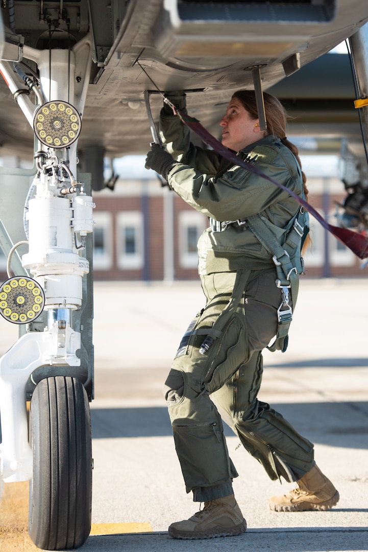 Lt. Col. Jennifer Ovanek, an A-10 Thunderbolt II pilot with the Idaho Air National Guard's 190th Fighter Squadron, conducts a preflight inspection at Gowen Field, Boise, Idaho, March 13, 2022.