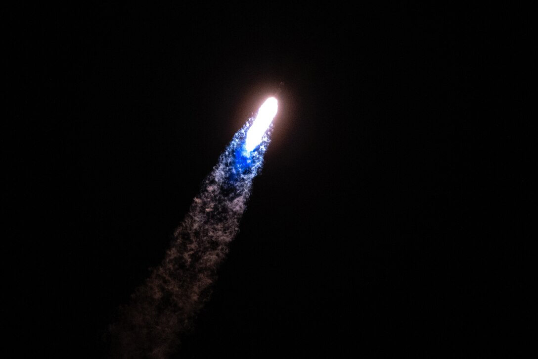A rocket soars through space.