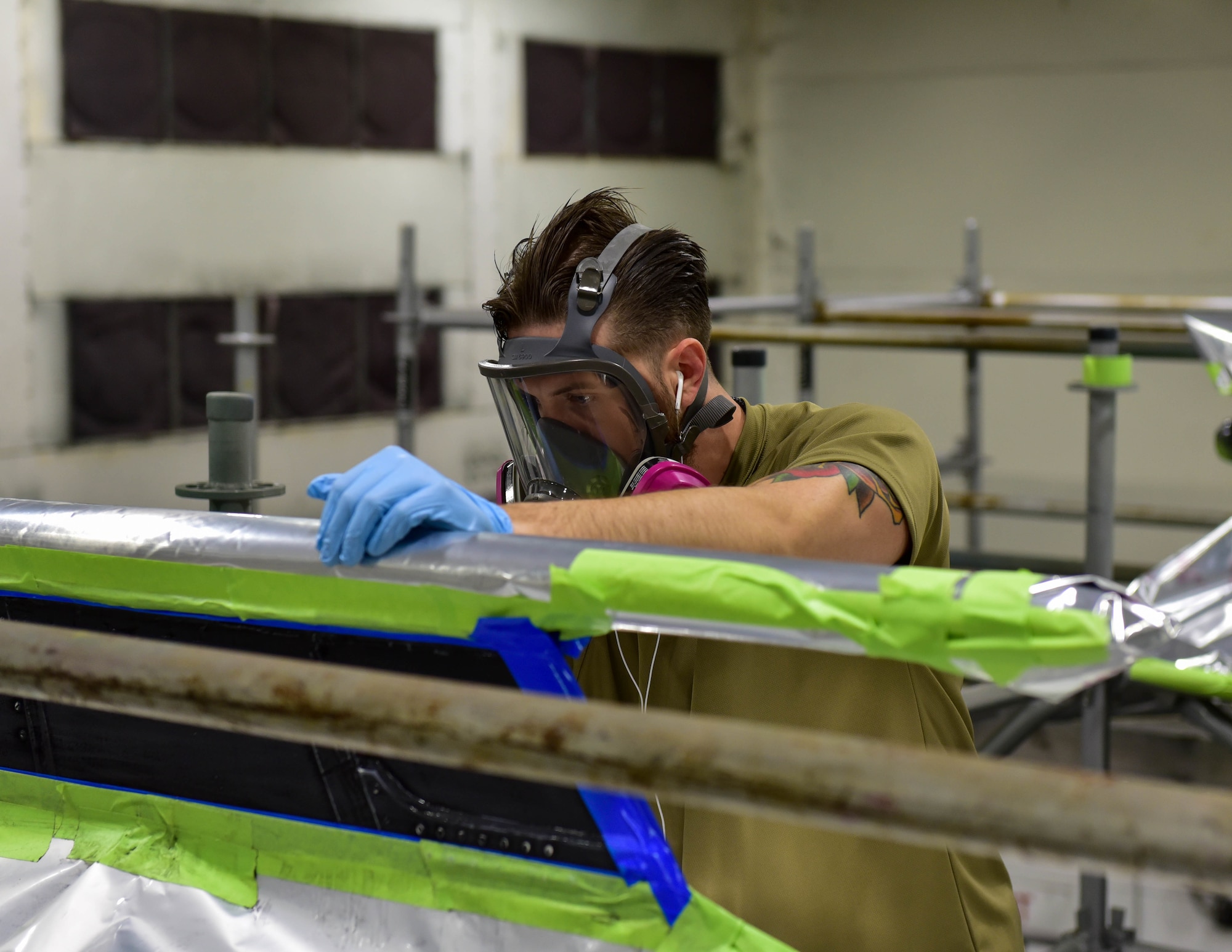 Staff Sgt. Chad Courtwright, CTK Custodian, of the 4th Equipment Maintenance Squadron makes small corrections on the tail flash of an F-15 Eagle aircraft. The paint is inspired by the 336th Fighter Generation Squadron emblem.(U.S. Air Force photo by Senior Airman Taylor Hunter)