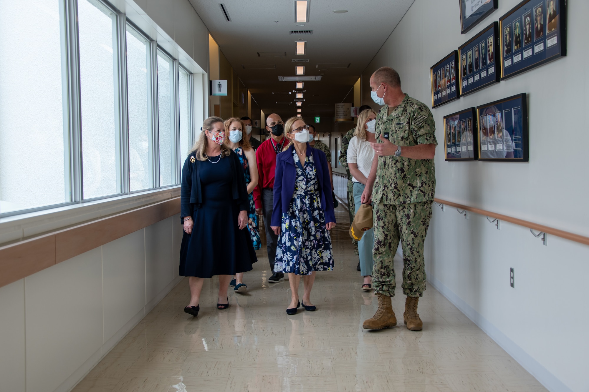 A seaman gives a tour of a hospital