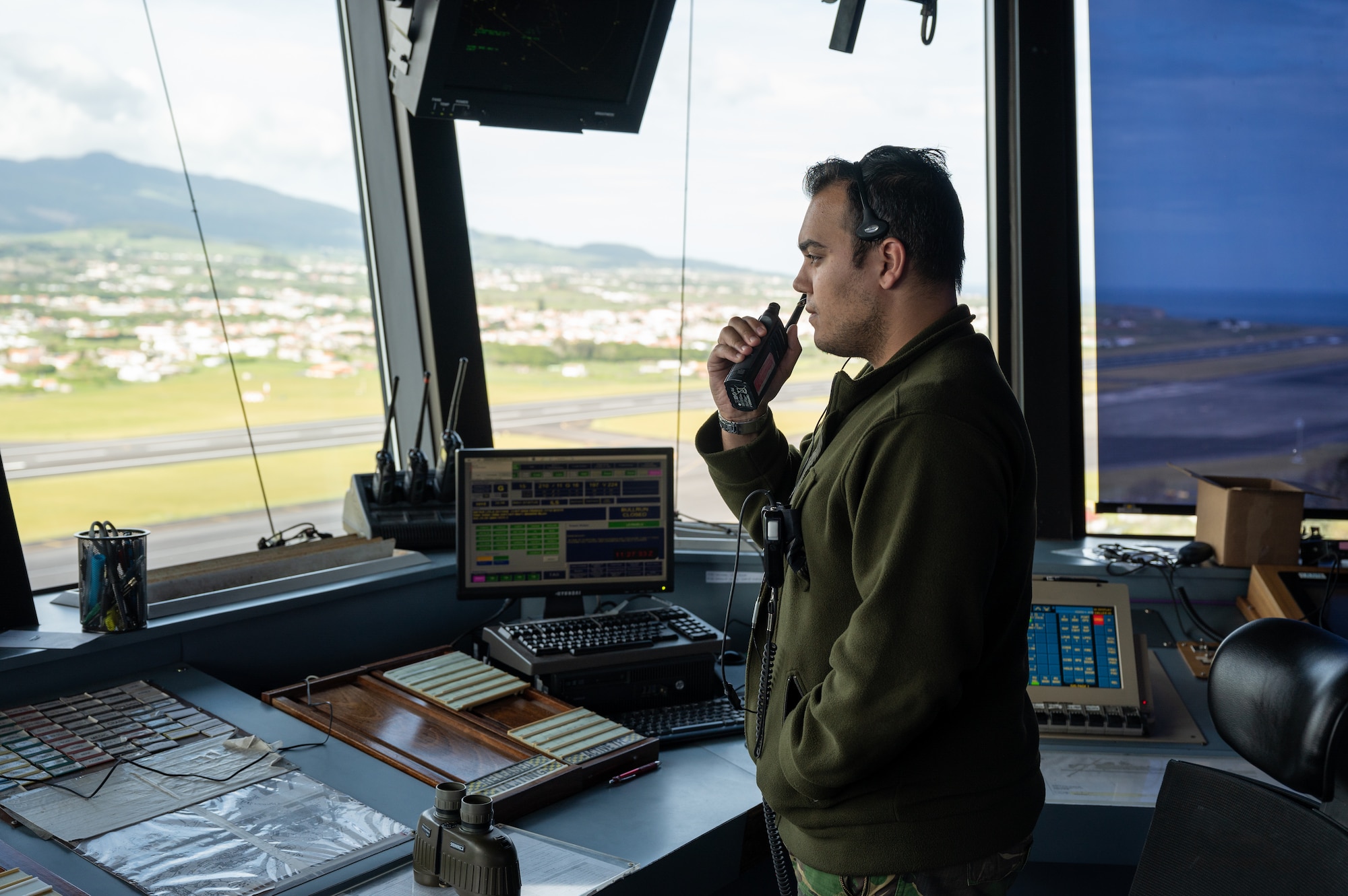 Service member working in an air traffic control tower.
