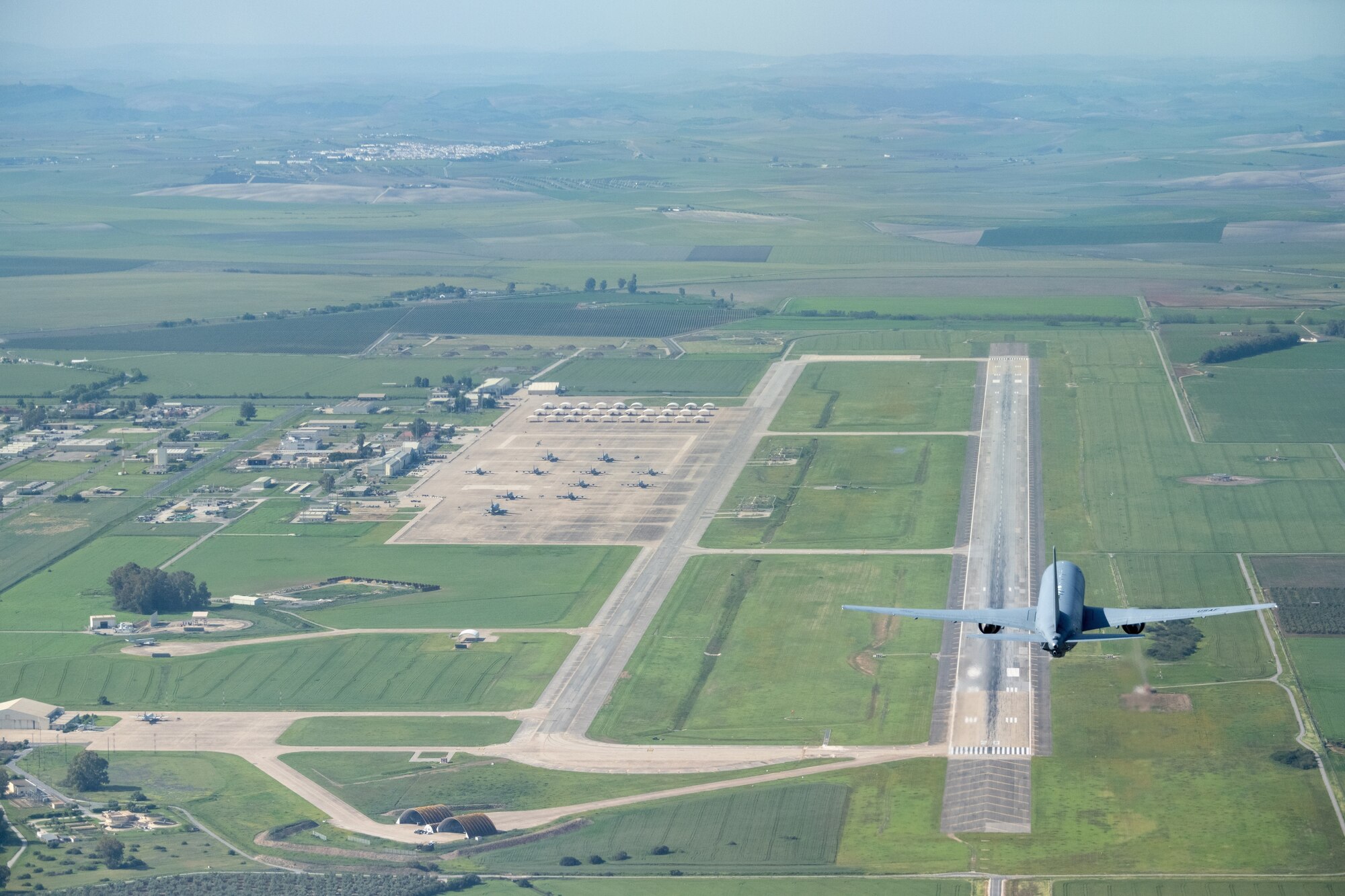 A KC-46A Pegasus from McConnell Air Force Base, Kansas, begins an overpass before landing at Morón Air Base, Spain, April 18, 2022.