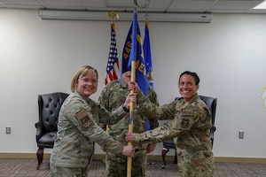 Group commander passes the unit flag to new commander.
