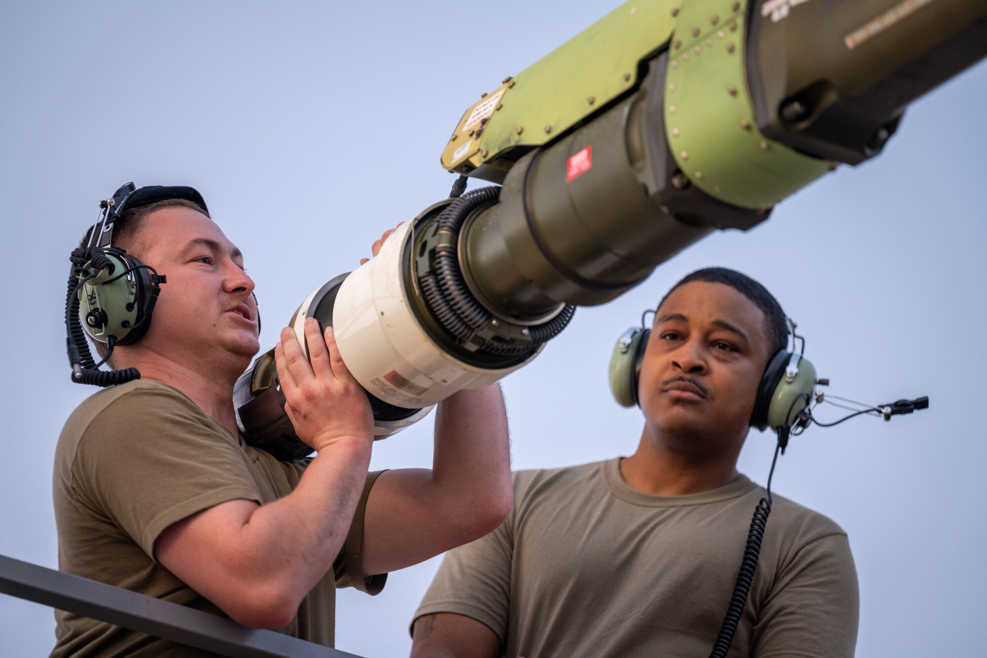 Staff Sgt. Seth Cook (left), 22nd Aircraft Maintenance Squadron (AMXS) hydraulics craftsman, alongside Master Sgt. Martin McAllister, 22nd AMXS production superintendent, attempts to rotate a stuck recoil assembly on a KC-46A Pegasus April 17, 2022, at Morón Air Base, Spain.