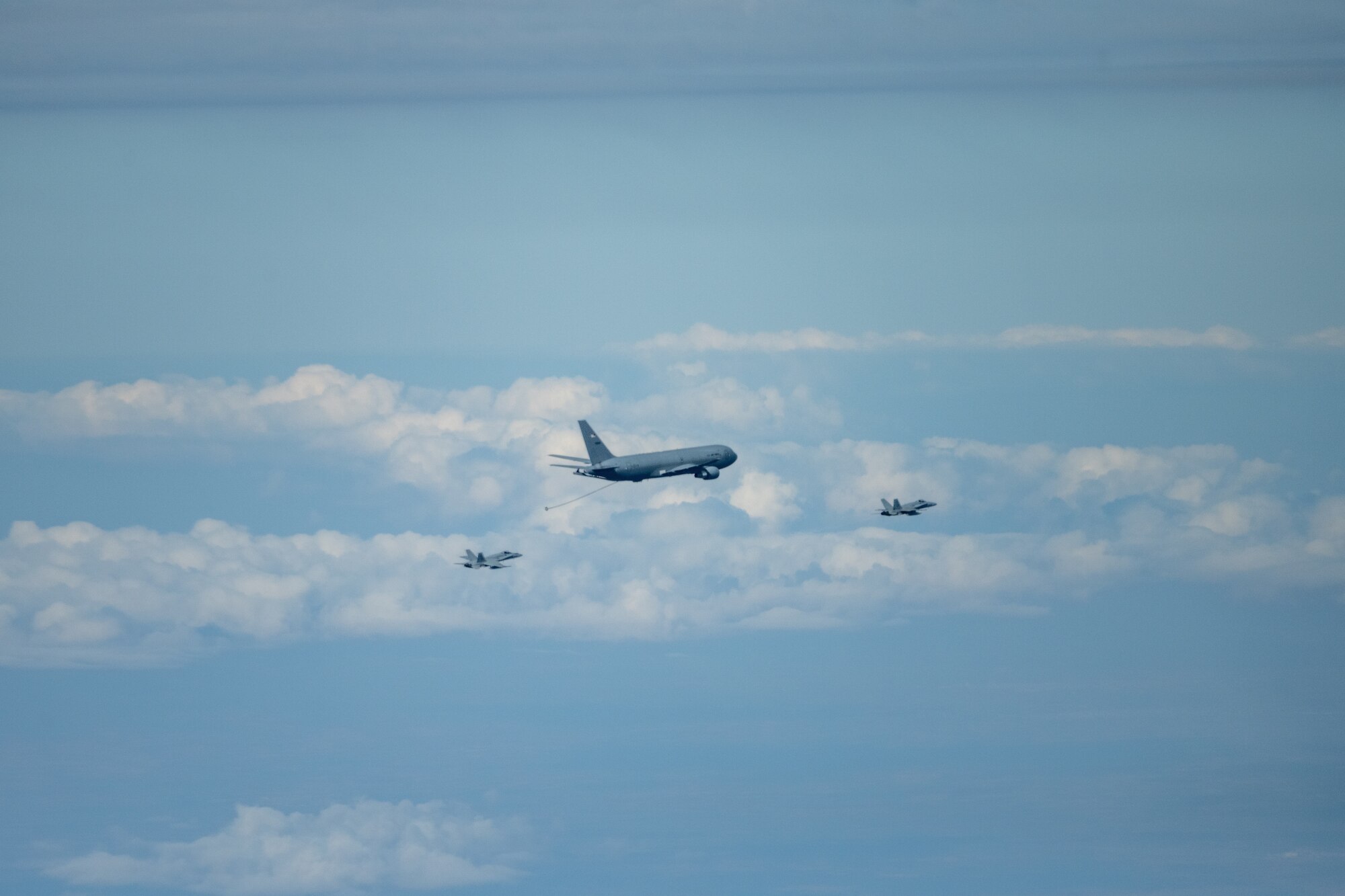 A Spanish Air Force C-15 approaches a U.S. Air Force KC-46A Pegasus for refueling off the aircraft’s centerline drogue April 18, 2022.