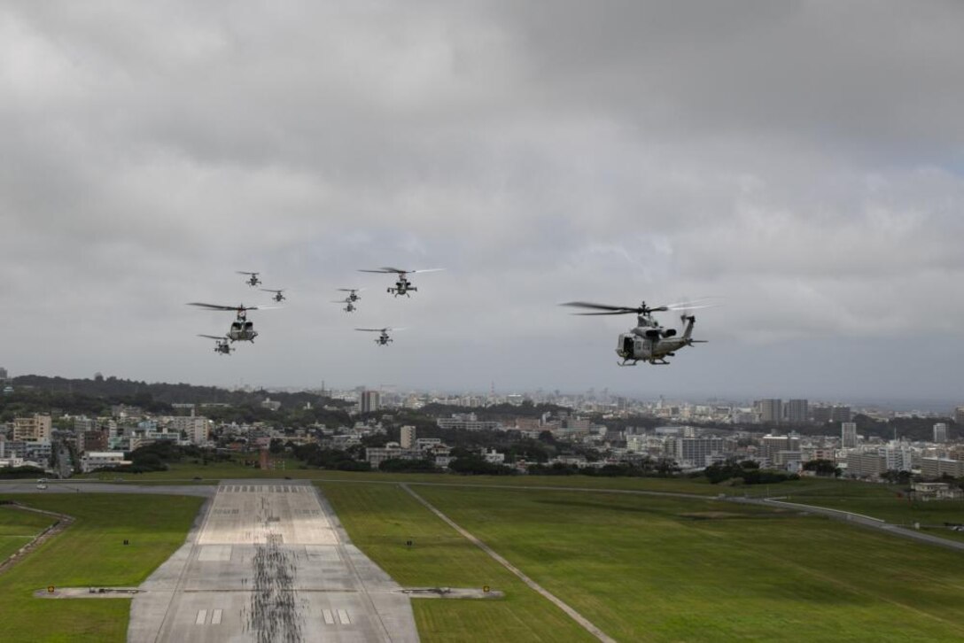 U.S. Marines with Marine Light Attack Helicopter Squadron (HMLA) 369 fly in formation during a training exercise at Ie Shima, Okinawa, Japan, April 29, 2022. HMLA-369 successfully launched multiple aircraft for a single flight as a display of appreciation for the hard work of the squadron.