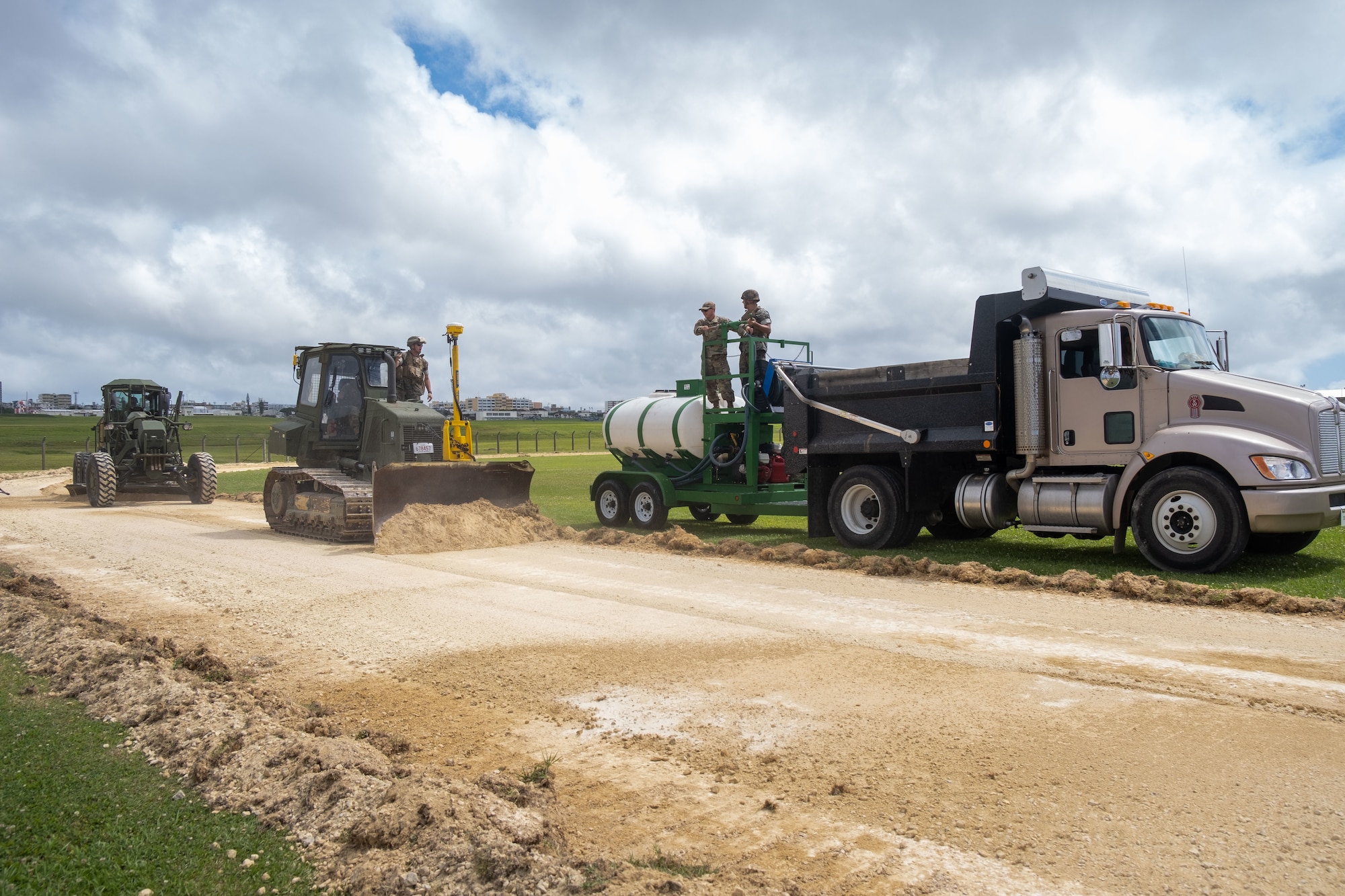 Airmen and Marines operate heavy equipment.