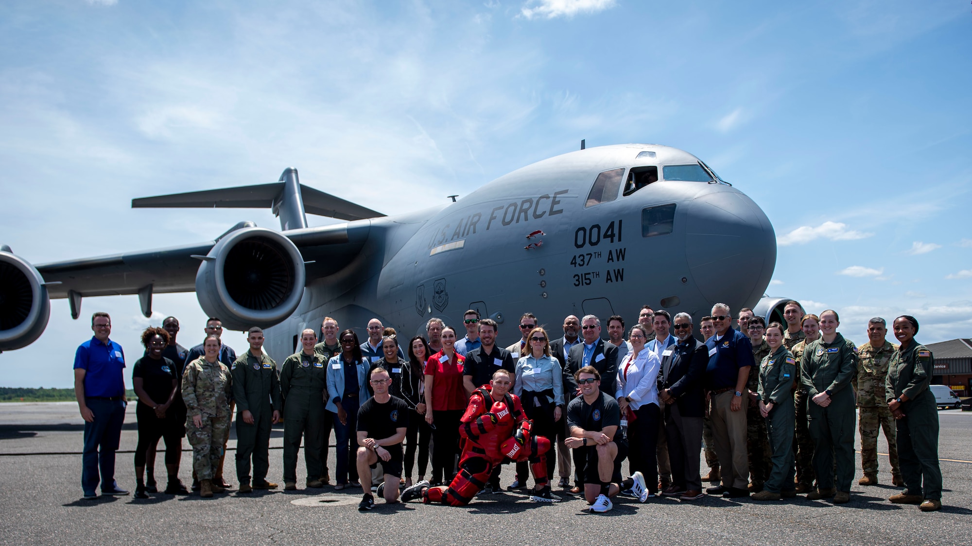 A group of civic leaders from the Tampa Bay area pose with service members assigned to Joint Base Charleston, for a photo near a C-17 Globemaster III at Joint Base Charleston, South Carolina, April 21, 2022. The civic leader group toured the Charleston aircraft during multi-base field trip to strengthen relations and bolster community support. (U.S. Air Force photo by Airman 1st Class Lauren Cobin)