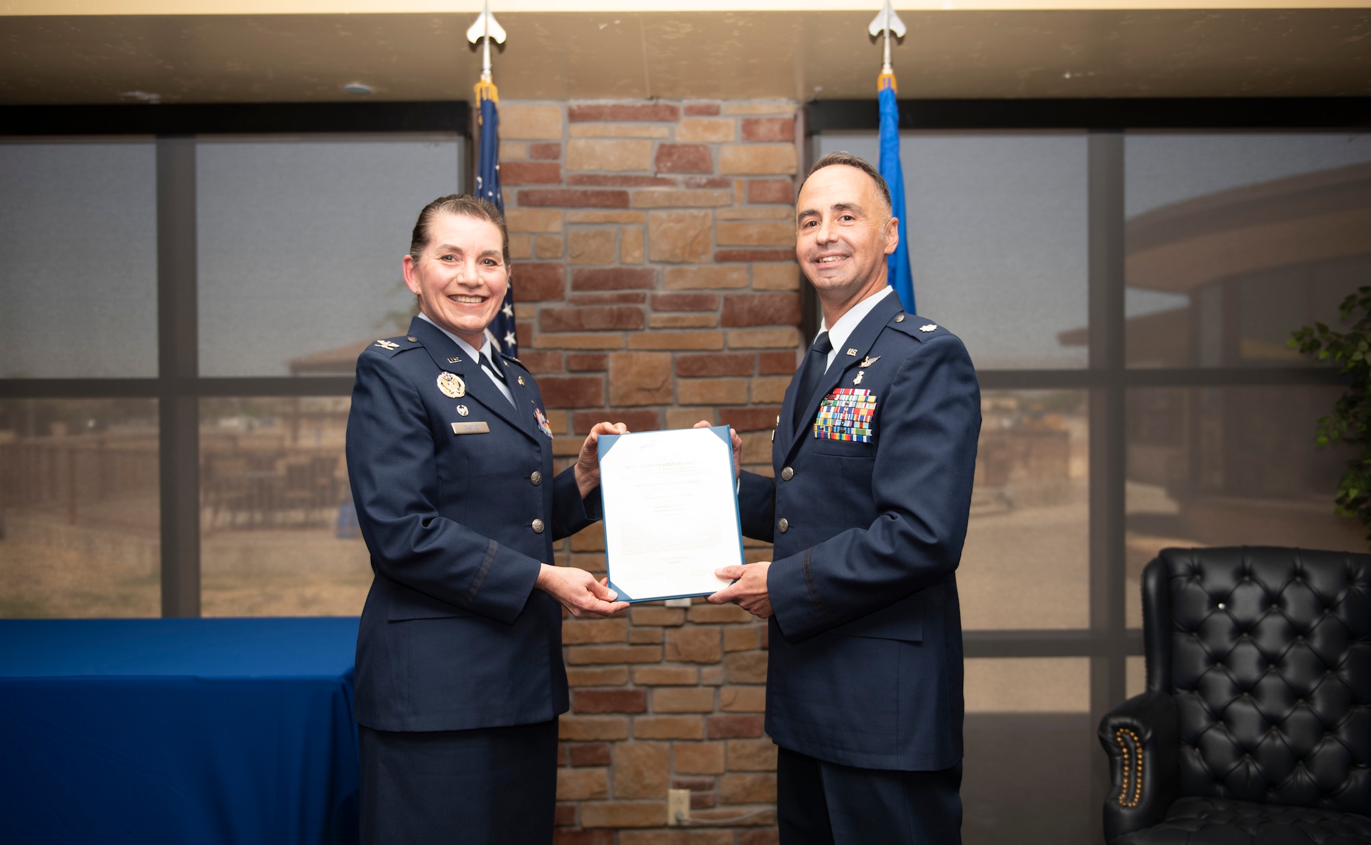 Col. Valerie Castle, 49th Medical Group commander, presents the Meritorious Service Medal to Lt. Col. Jack Vilardi, former 49th Medical Support Squadron commander, during the 49th MDSS inactivation ceremony in Club Holloman, April 29, 2022, on Holloman Air Force Base, New Mexico.