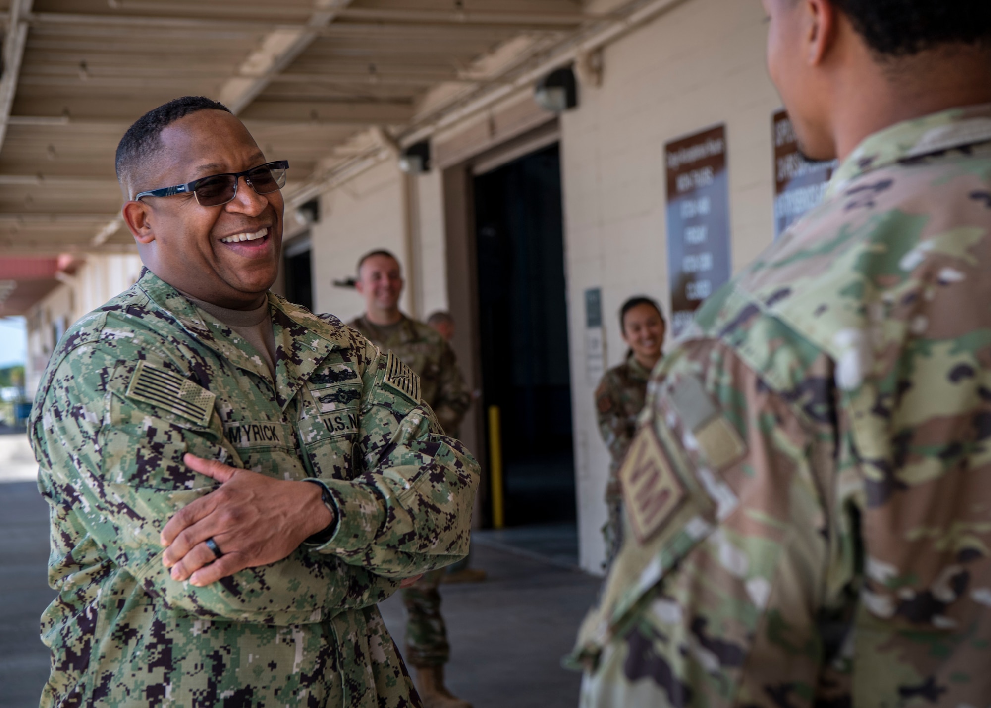 U.S. Navy Fleet Master Chief Donald Myrick, U.S. Transportation Command senior enlisted leader, speaks with airmen assigned to the 6th Logistics Readiness Squadron during a tour at MacDill Air Force Base, Florida, April 29, 2022. Myrick visited the 6th LRS to learn more about their role in supporting large scale readiness operations. (U.S. Air Force photo by Airman 1st Class Lauren Cobin)