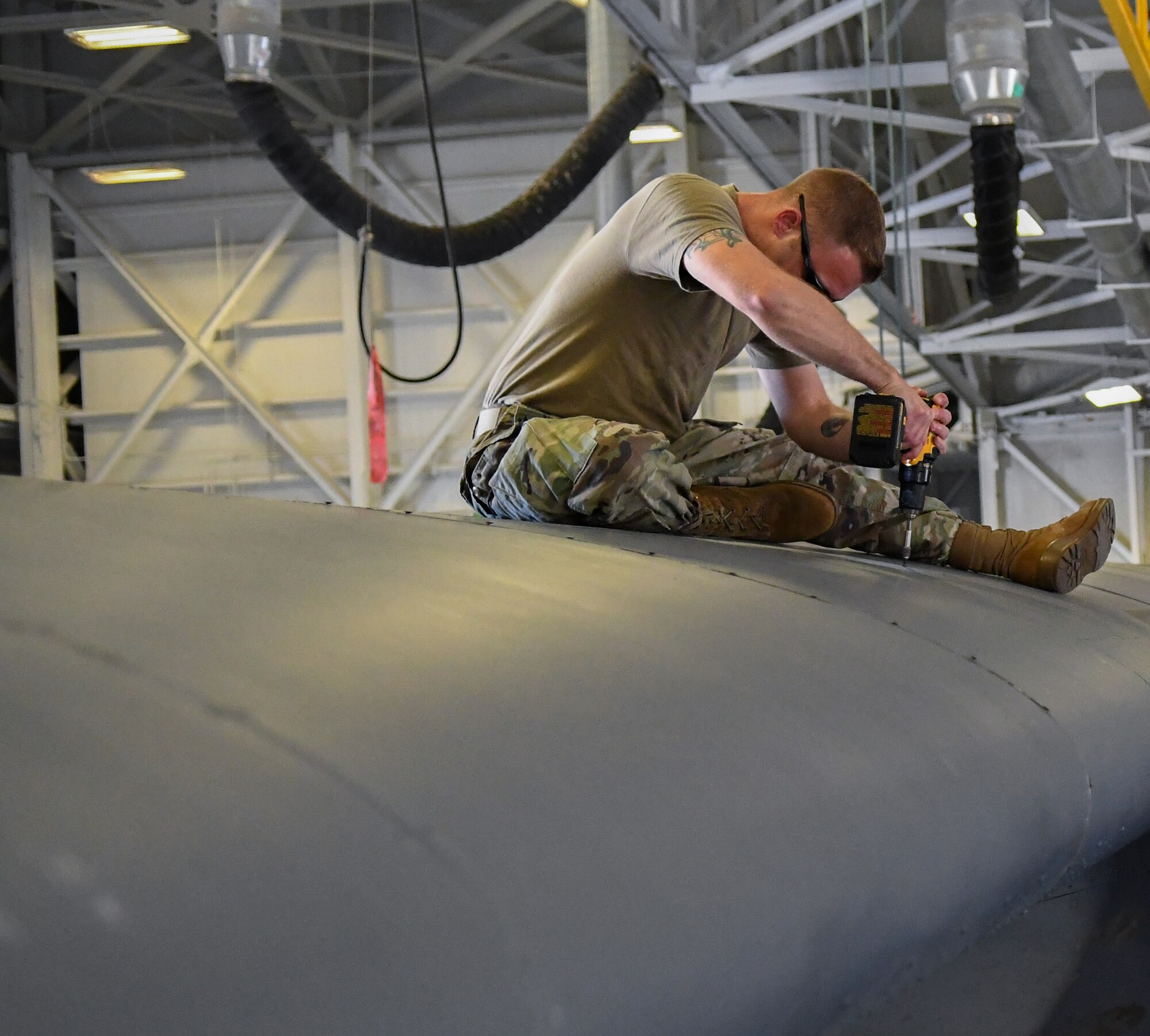 Staff Sargent Justin Realmuto, 920th Maintenance Squadron mechanic, finishes reattaching a newly repaired HC-130J Combat King II leading edge panel after it encountered a bird strike and required repairs at Patrick Space Force Base, Fla., April 26, 2022. (U.S. Air Force photo by Staff Sgt. Darius Sostre-Miroir)