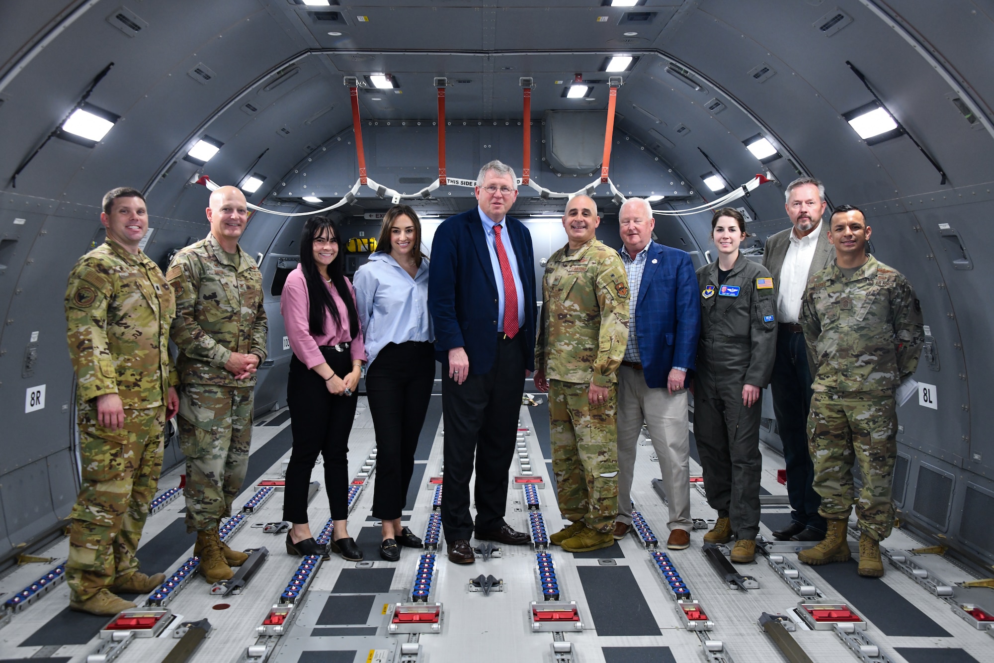 Rep. Frank Lucas, Oklahoma congressman, poses for a photo with members of his team, community and 97th Air Mobility Wing leaders in a KC-46 Pegasus at Altus Air Force Base, Oklahoma, April 22, 2022. The team discussed the next generation aircraft’s ability to provide aerial refueling by using a 3-D vision system, among other topics, ensuring the Air Force’s ability to respond globally and sustain the fight. (U.S. Air Force photo by Airman 1st Class Miyah Gray)