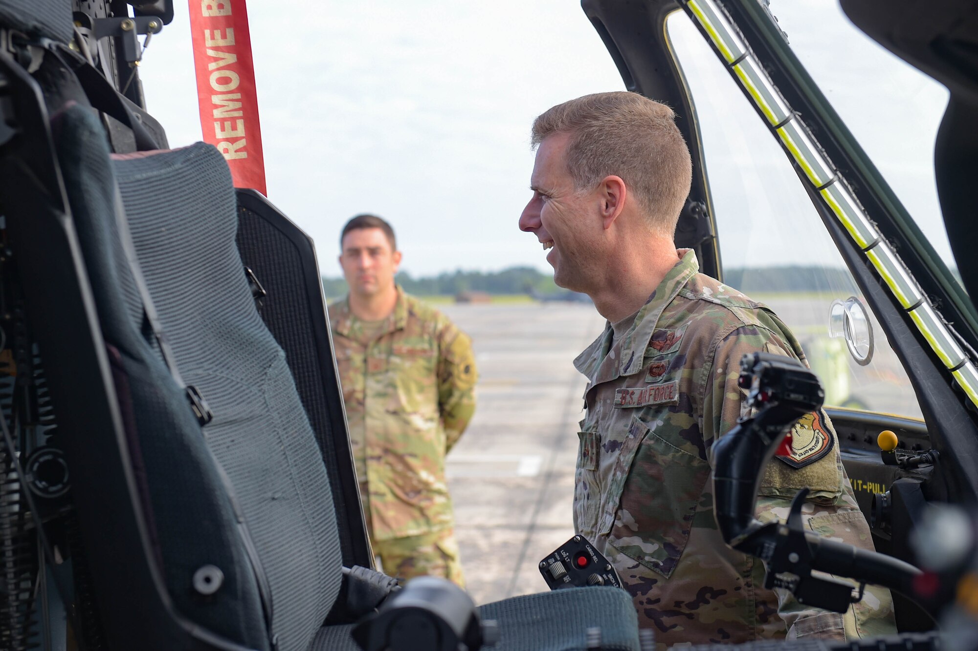 A photo of an Airman smiling.