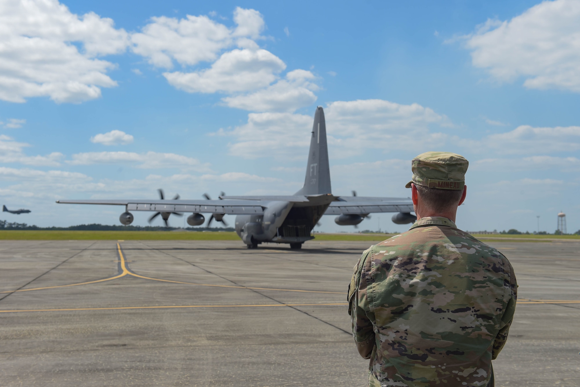 A photo of an Airman looking at an aircraft.
