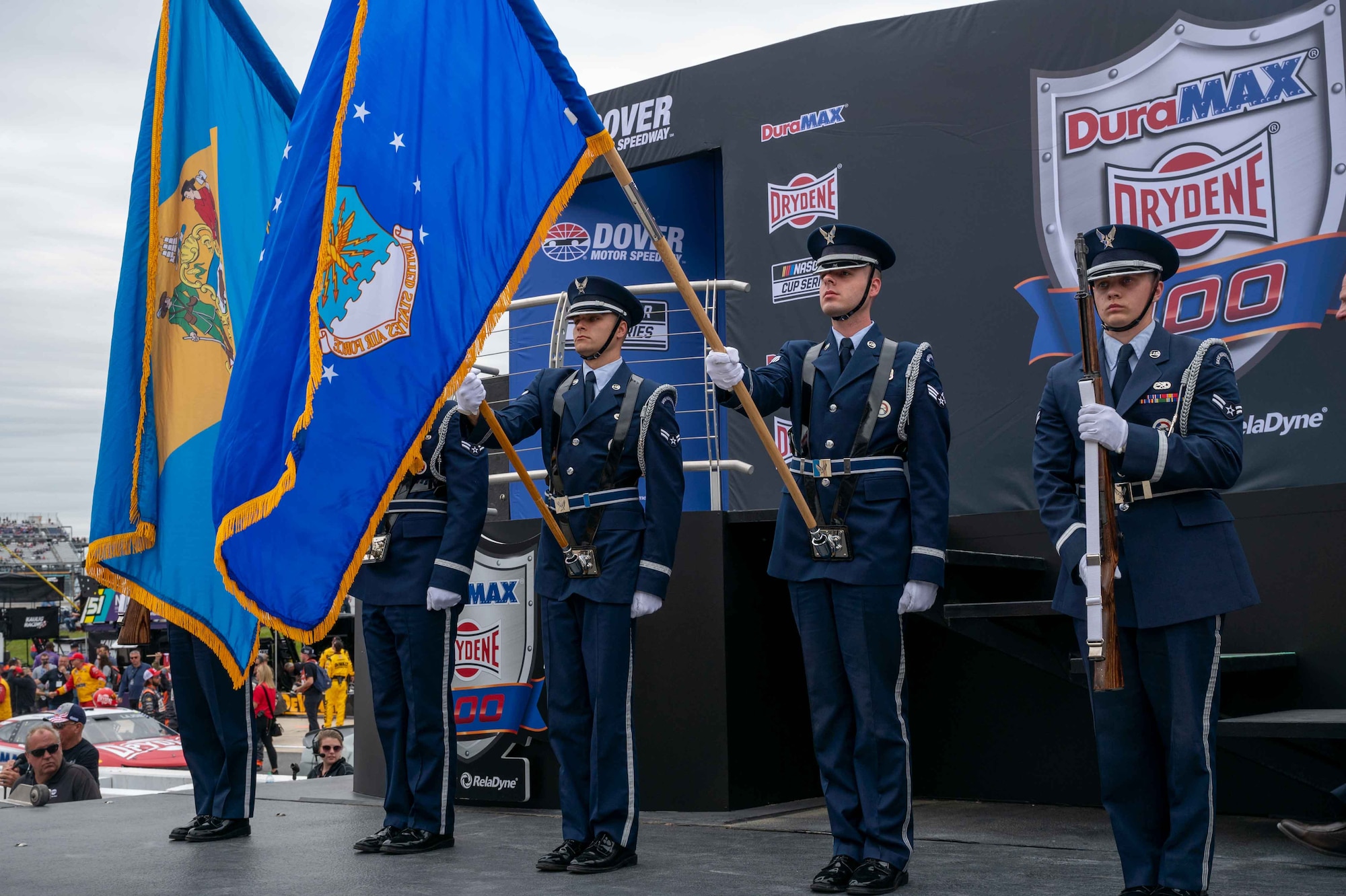 Dover Air Force Base Honor Guard members present the colors before the Drydene 400 NASCAR race at Dover Motor Speedway in Dover, Delaware, May 1, 2022. The Honor Guard presented the colors during pre-race events throughout the 2022 NASCAR weekend. (U.S. Air Force photo by Senior Airman Faith Schaefer)