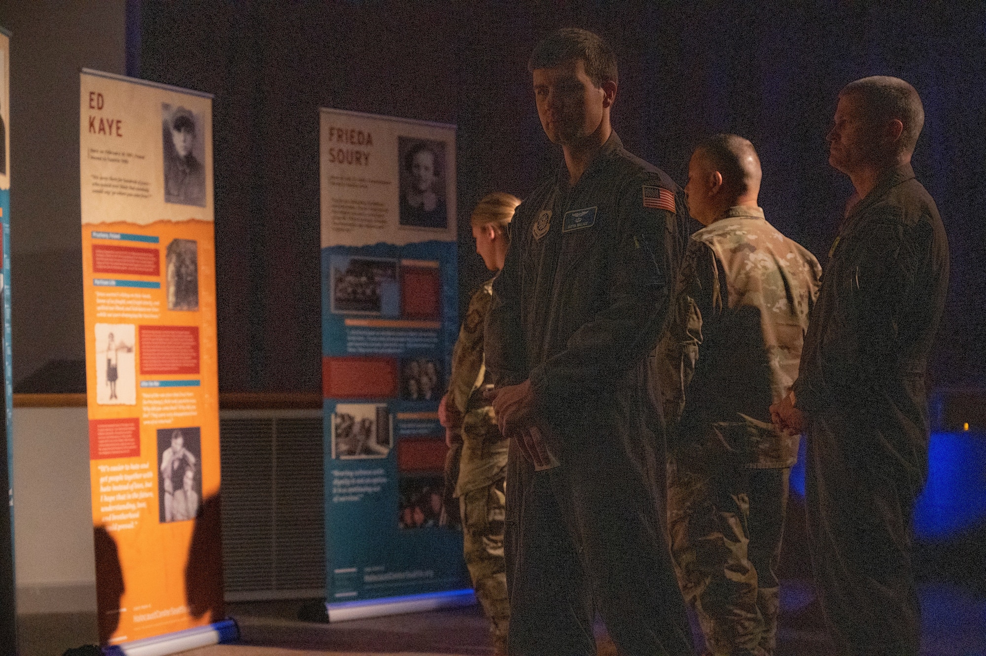U.S. Air Force Airmen read about the history of the Holocaust at the Holocaust Remembrance Day ceremony at Joint Base Lewis-McChord, Washington, April 28, 2022. The ceremony gave Airmen the opportunity to learn about the Holocaust and experiences of survivors. (U.S. Air Force photo by Airman 1st Class Charles Casner)