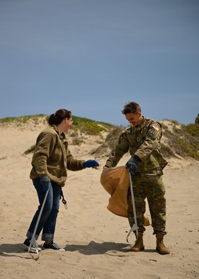 Volunteers help clean up Surf Beach located on Vandenberg Space Force Base, Calif., on April 27, 2022. Once a quarter, volunteers gather at a beach on base and clean up litter to protect the environment. (U.S. Space Force photo by Airman 1st Class Kadielle Shaw)