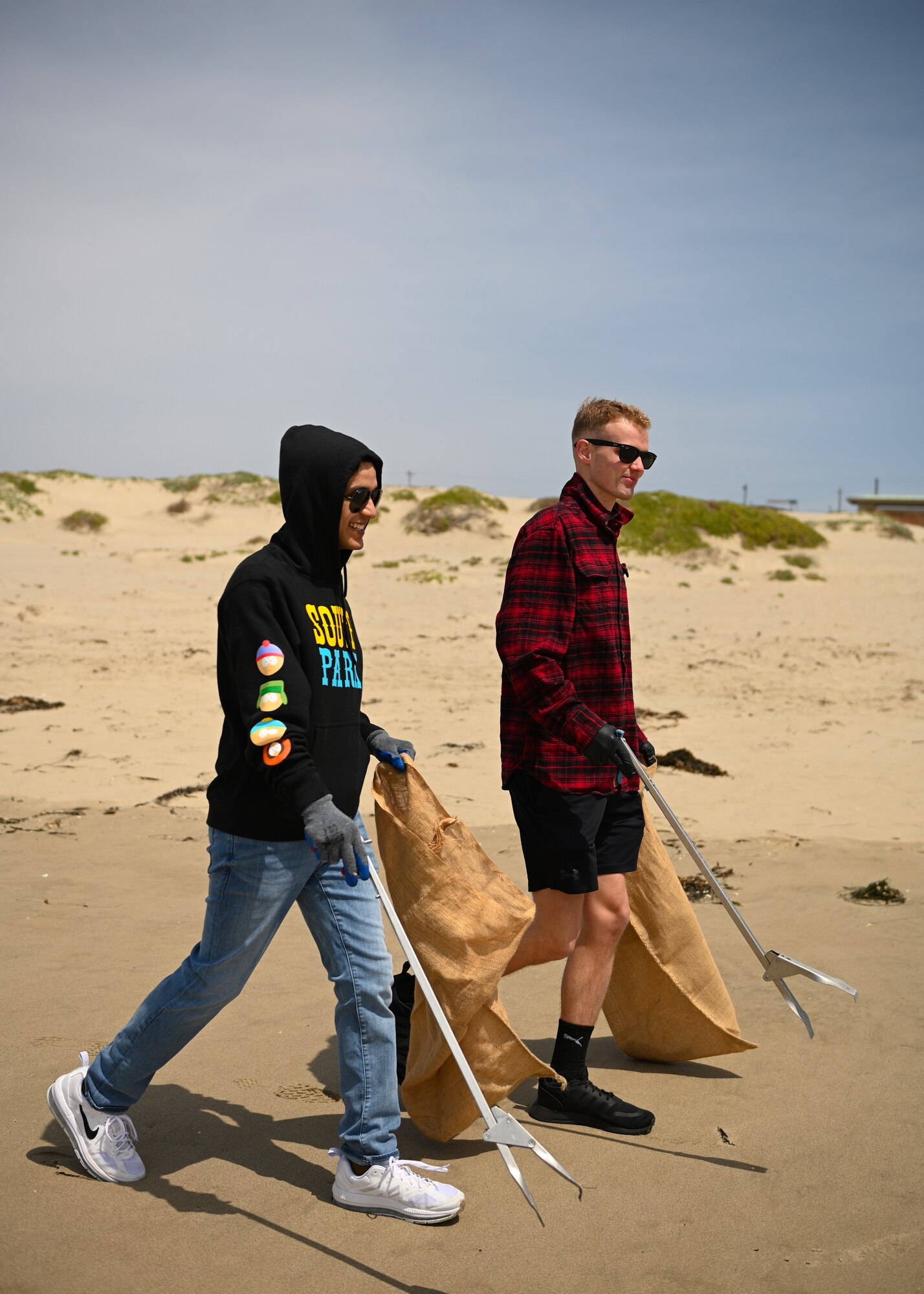 Volunteers help clean up Surf Beach located on Vandenberg Space Force Base, Calif., on April 27, 2022. Once a quarter, volunteers gather at a beach on base and clean up litter to protect the environment. (U.S. Space Force photo by Airman 1st Class Kadielle Shaw)